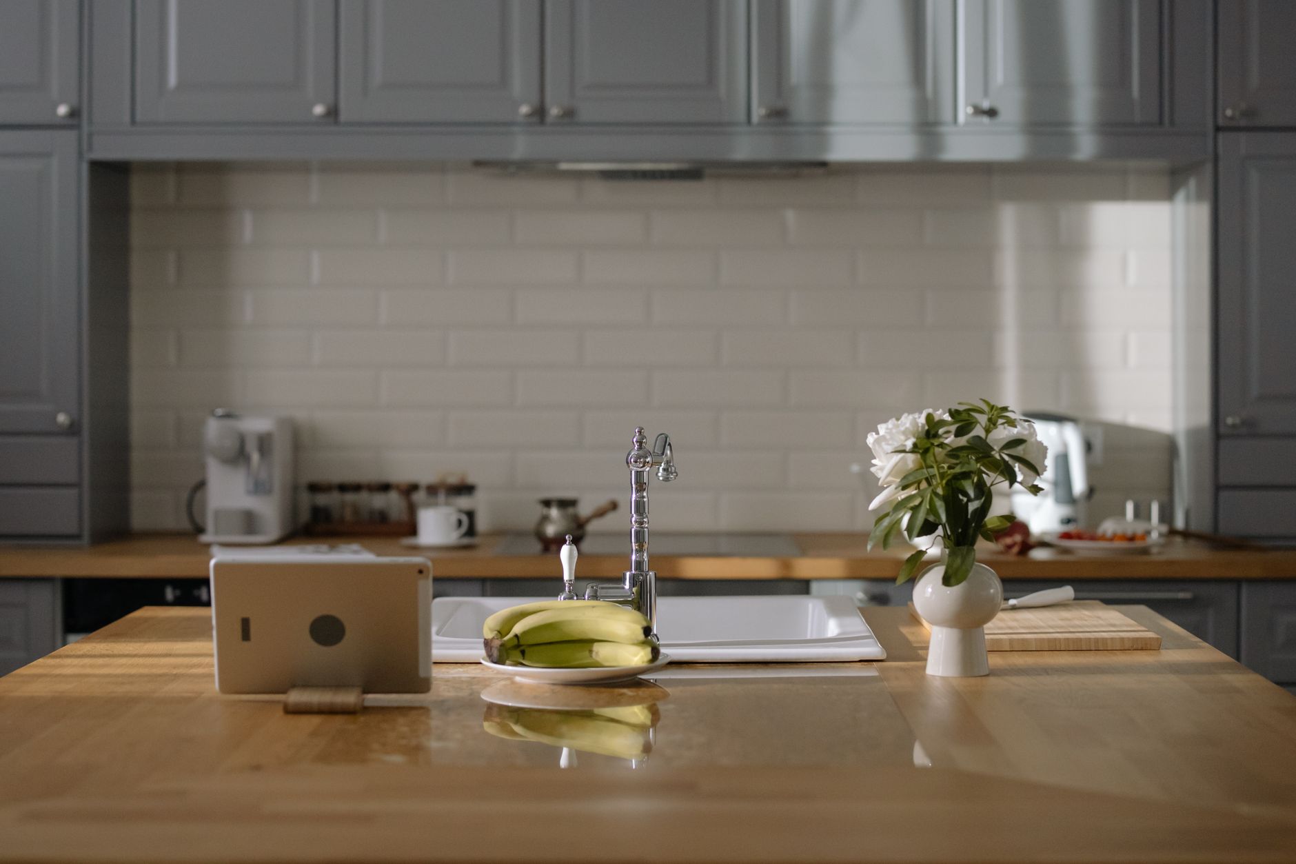 A tablet on a kitchen counter showing an open house sign-in screen