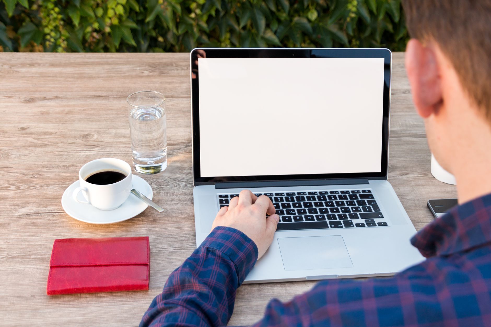 A real estate professional reading client reviews on a laptop
