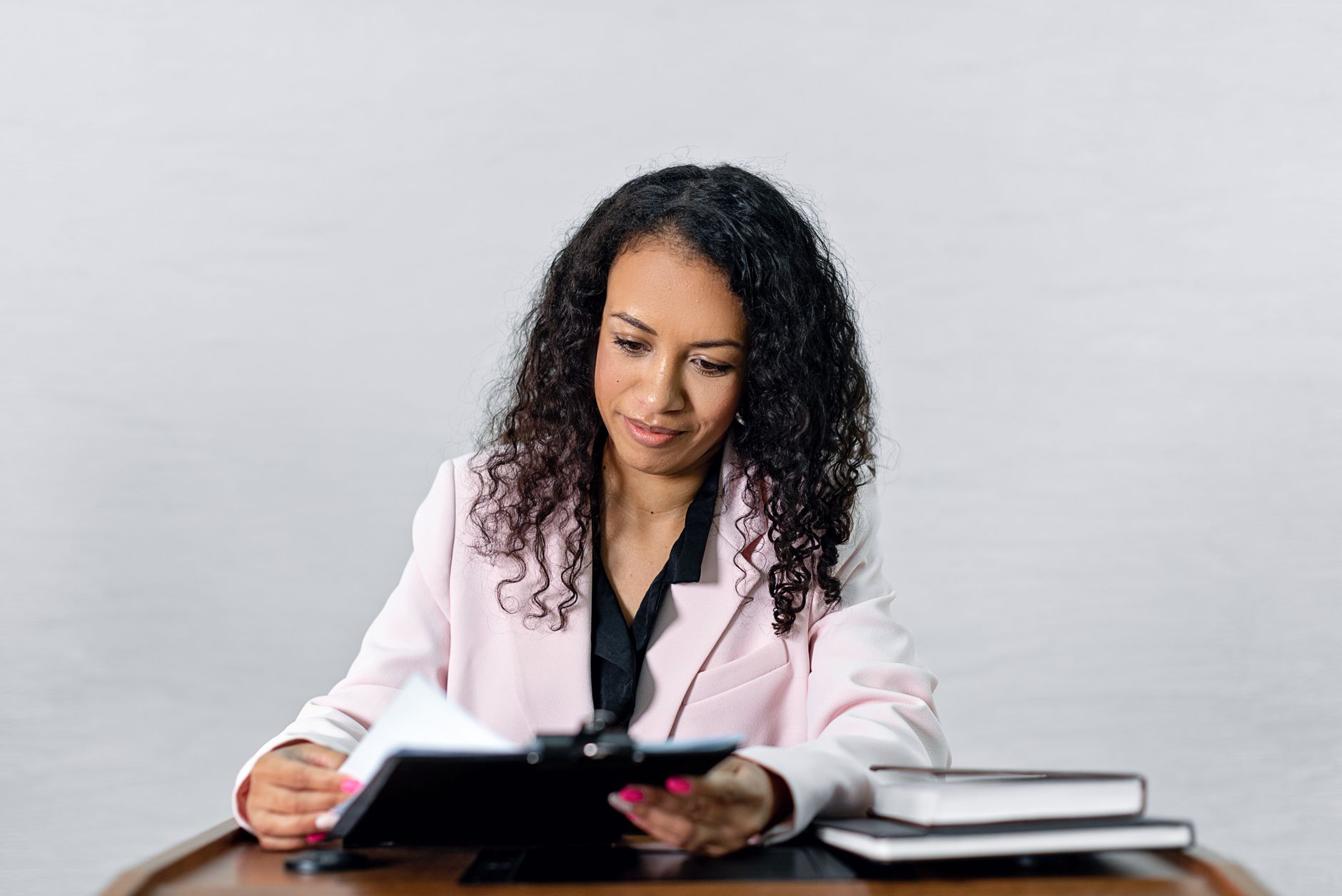 A loan officer reviewing compliance requirements at a desk