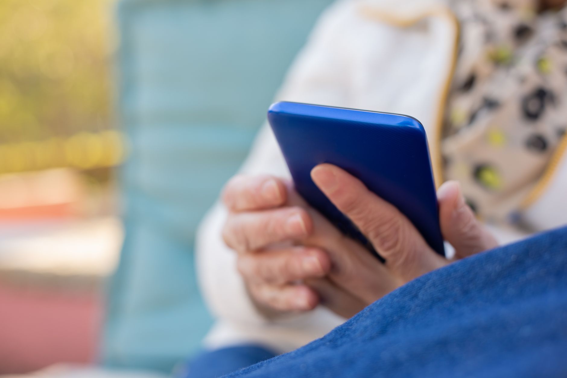 A real estate agent scrolling social media content on a phone