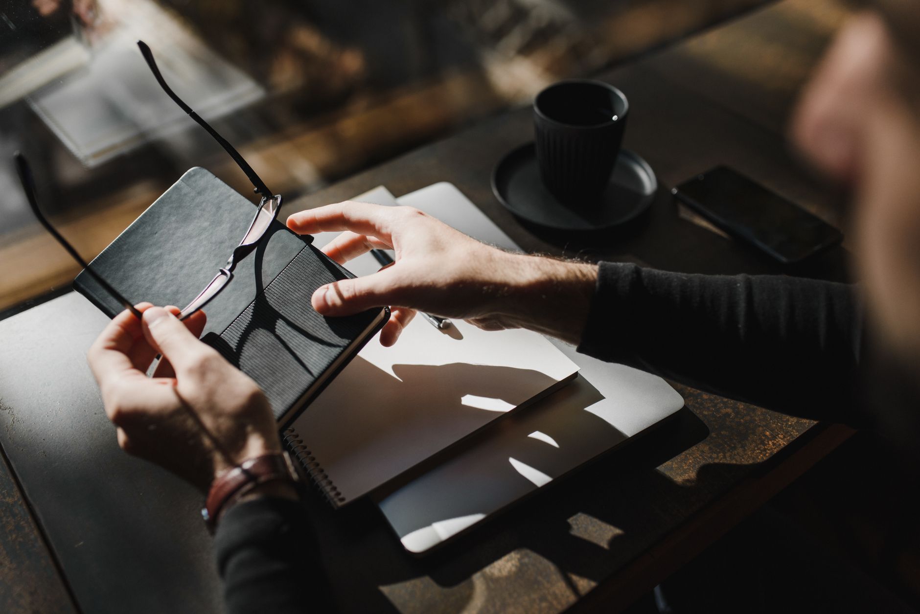 A real estate agent planning at a desk on a quiet winter morning